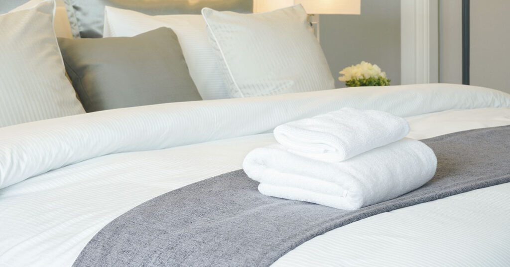 Every Hotel Room Has This Bed Cloth—But Most Don’t Know Why - Featured image