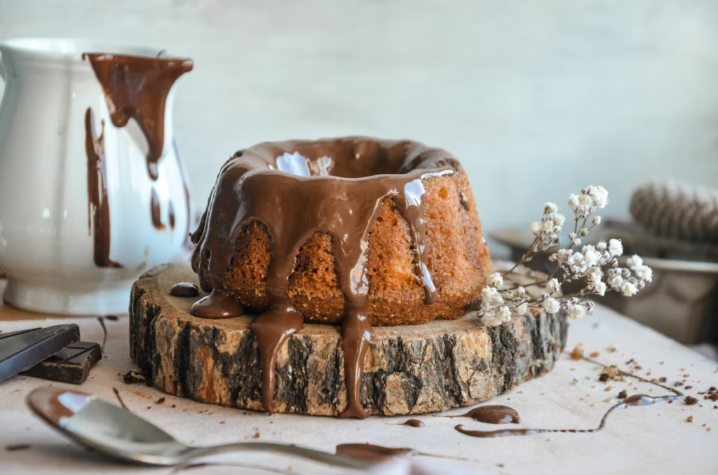 Bundt cake with chocolate glaze dripping down the sides.