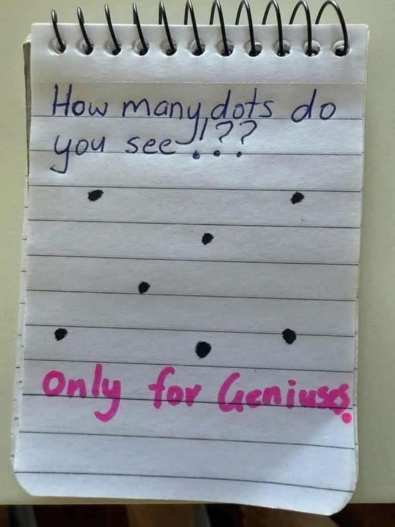 A quick IQ-test writen on a note pad saying, 'How many dots do you see!??" At the bottom is says "Only for Geniuses."