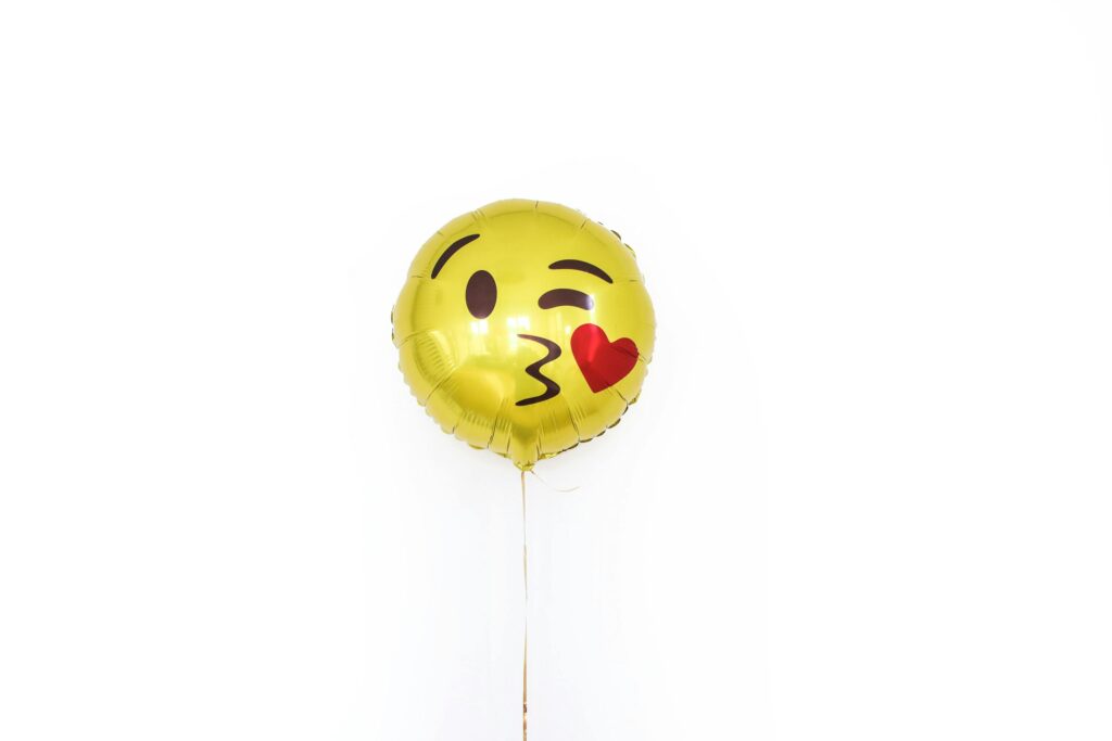 Yellow Foil Balloon with Smiley Kissing Face
