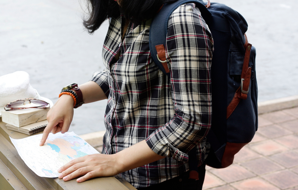 Women tour Viewing travel maps using a navigation map.