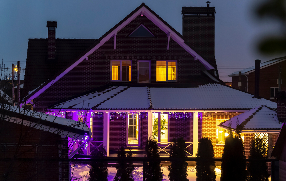House decorated with Christmas lights on New Year's Eve.