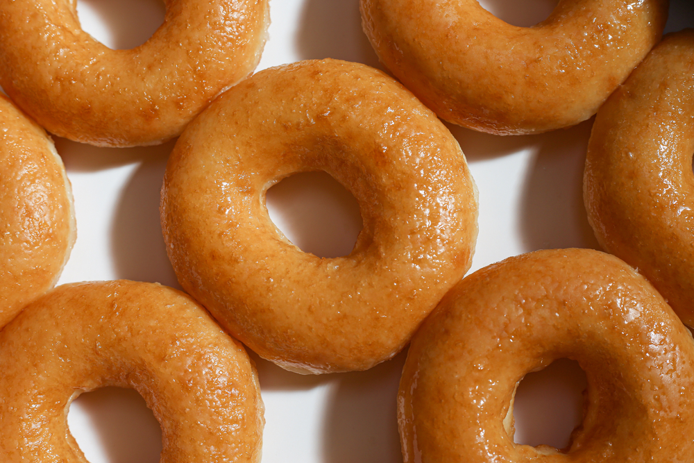 Glazed donuts original Delicious sugar pattern in box white, Selective focus