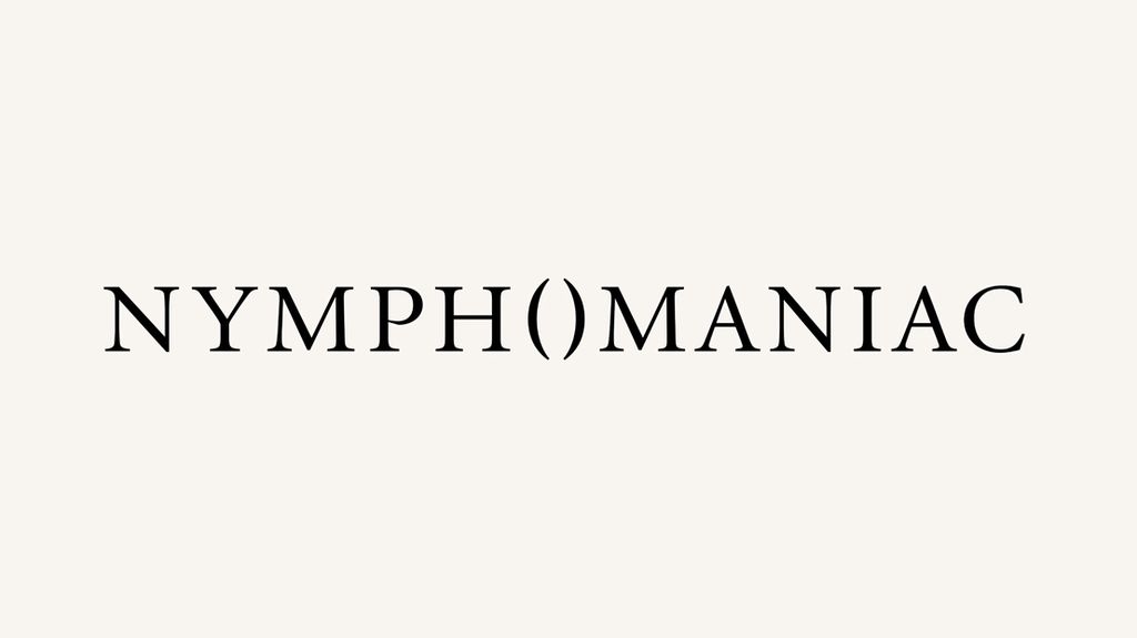 The word NYMPH()MANIAC in black serif type centered on a pale cream background, with empty parentheses splitting the word between NYMPH and MANIAC.