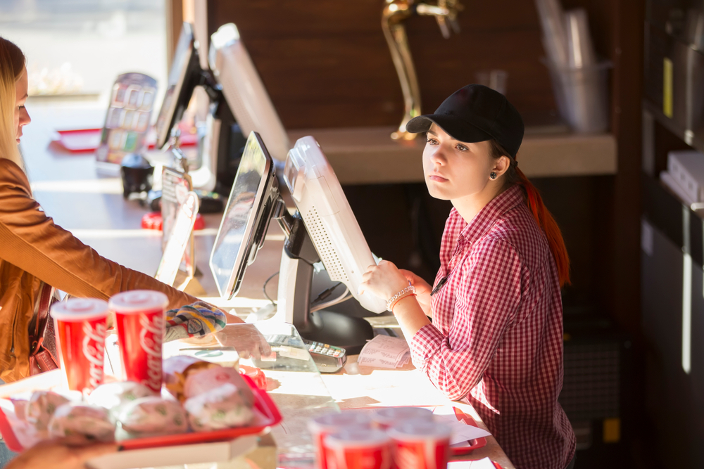 Belarus, Gomel, October 13, 2018. Holiday in the city. Children's Pavilion. The girl bartender. The waiter at the bar of the restaurant. The seller in the cafe