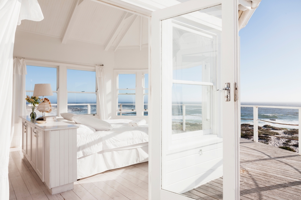 White home showcase bedroom overlooking ocean