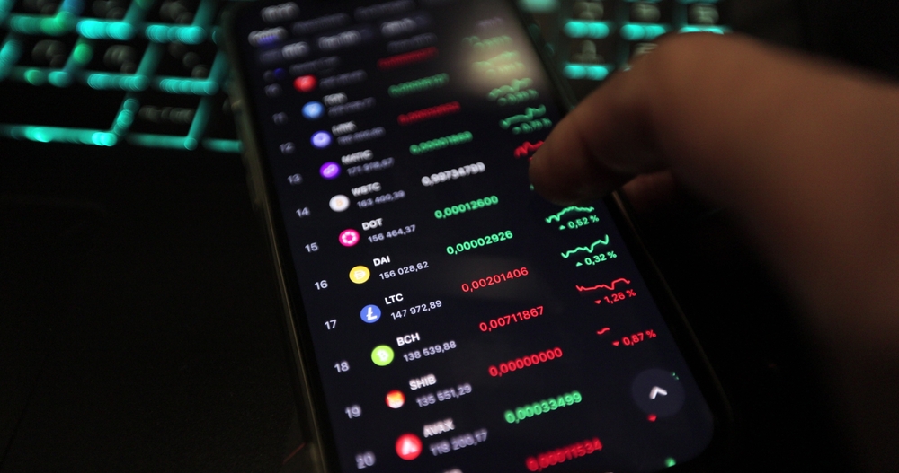 Man checking bitcoin, ethereum and other altcoin cryptocurrency price index on mobile phone screen. Crypto currency financial trader. Analyze growth stocks fund crypto coin.