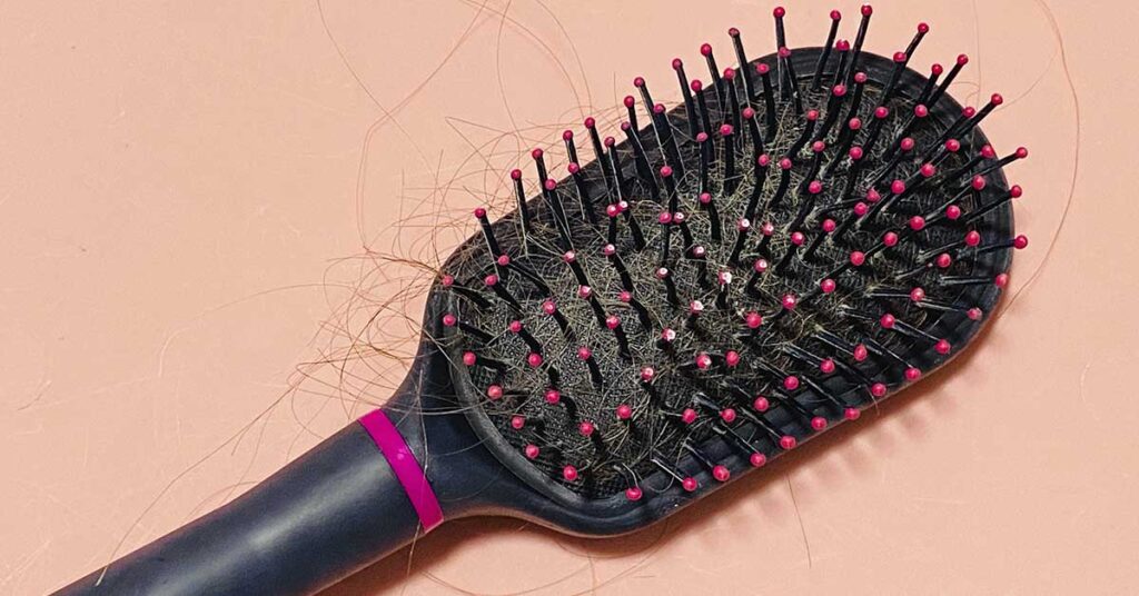 What That Gray Fuzz in Your Hairbrush Really Is (It’s Grosser Than You Think) - Featured image