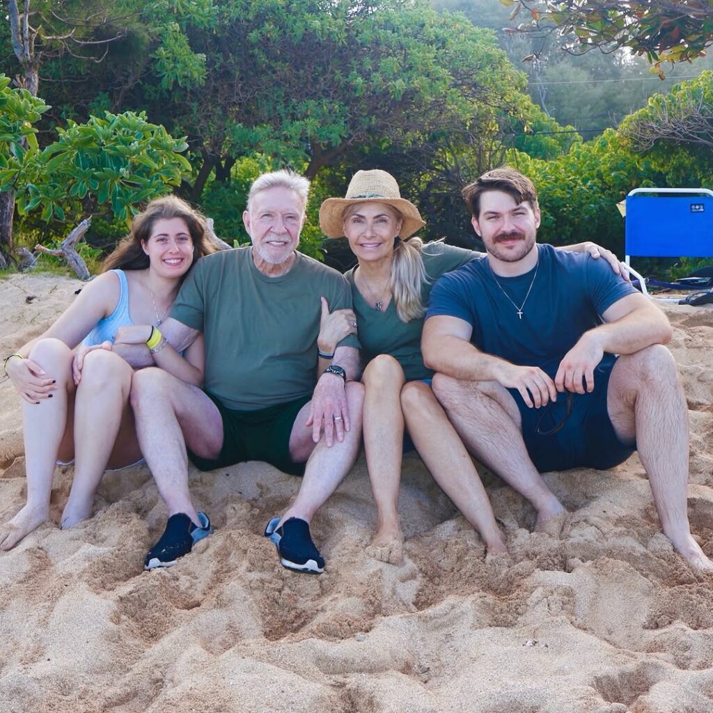 Chuck Norris with family on beach in Hawaii