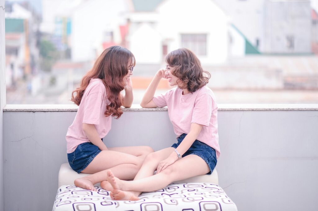 Two Women Wearing Pink T-shirts
