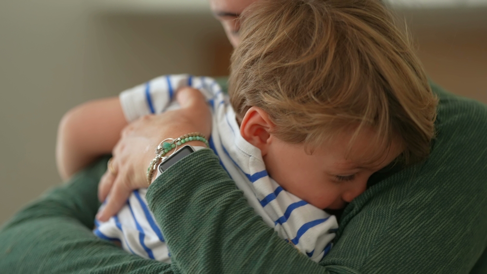 Motherhood love and affection. Parent hugging and embrace little boy son. Mom caring for child. Parenthood lifestyle