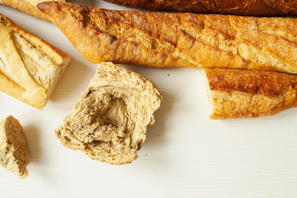 Baking, sourdough bread, dough products, flour, gluten. A variety of stale bread.  bread texture  on a white background, close-up. overconsumption, food waste. copy space