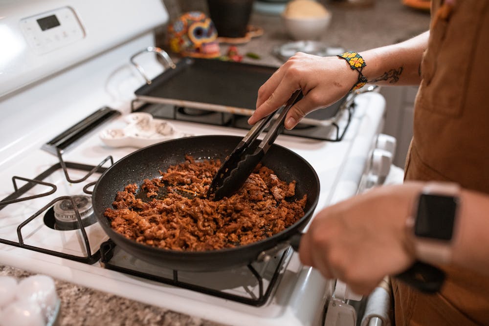ground beef being cooked on stove