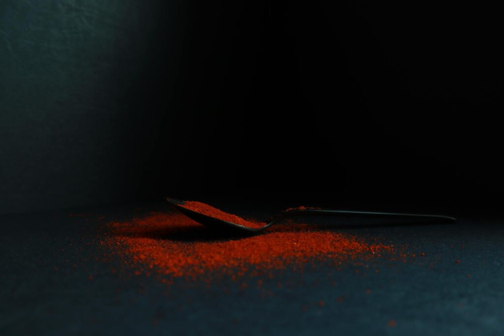 paprika powder on black background