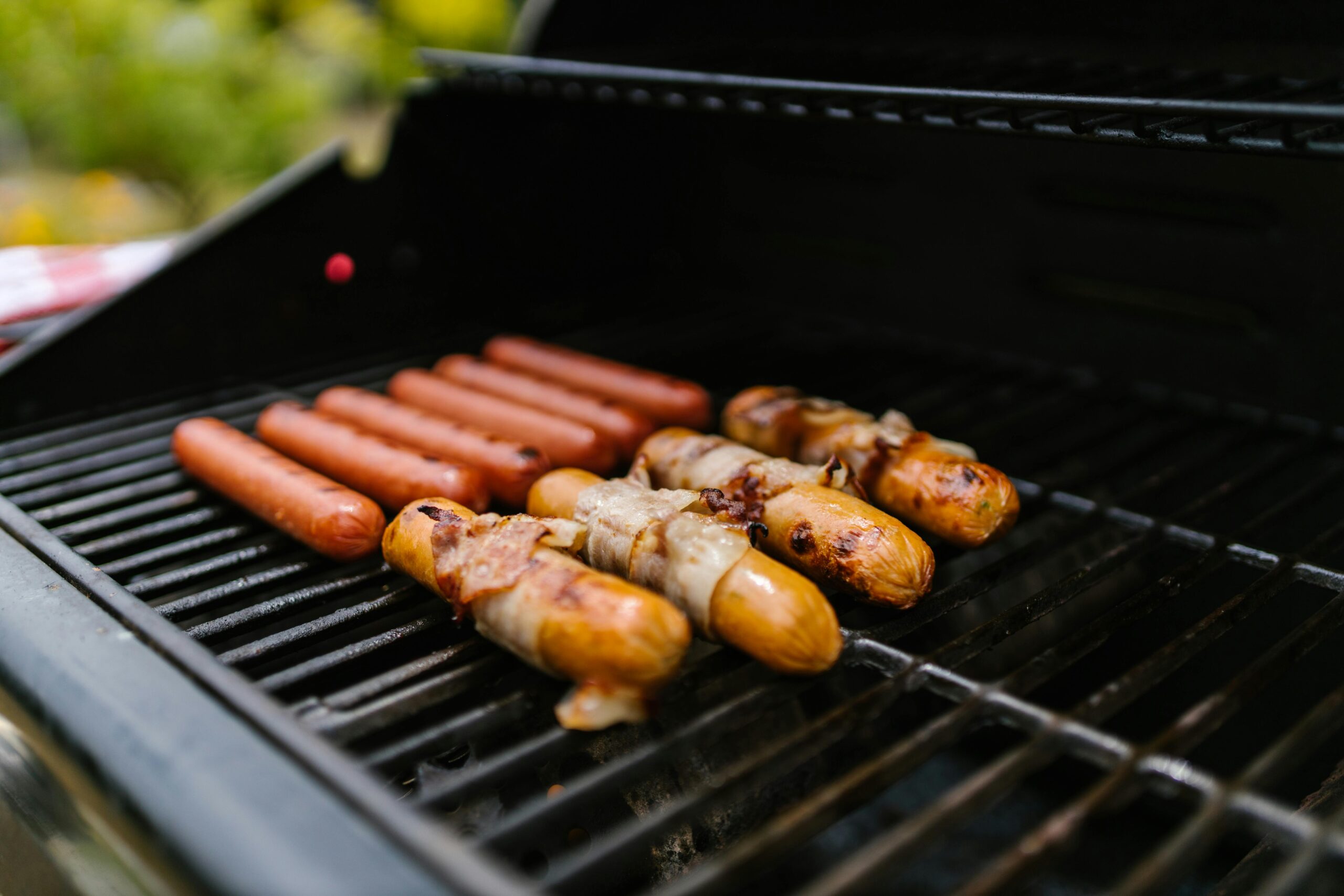 Close-up Grilling Hotdogs in a Griller processed meat linked to cancer