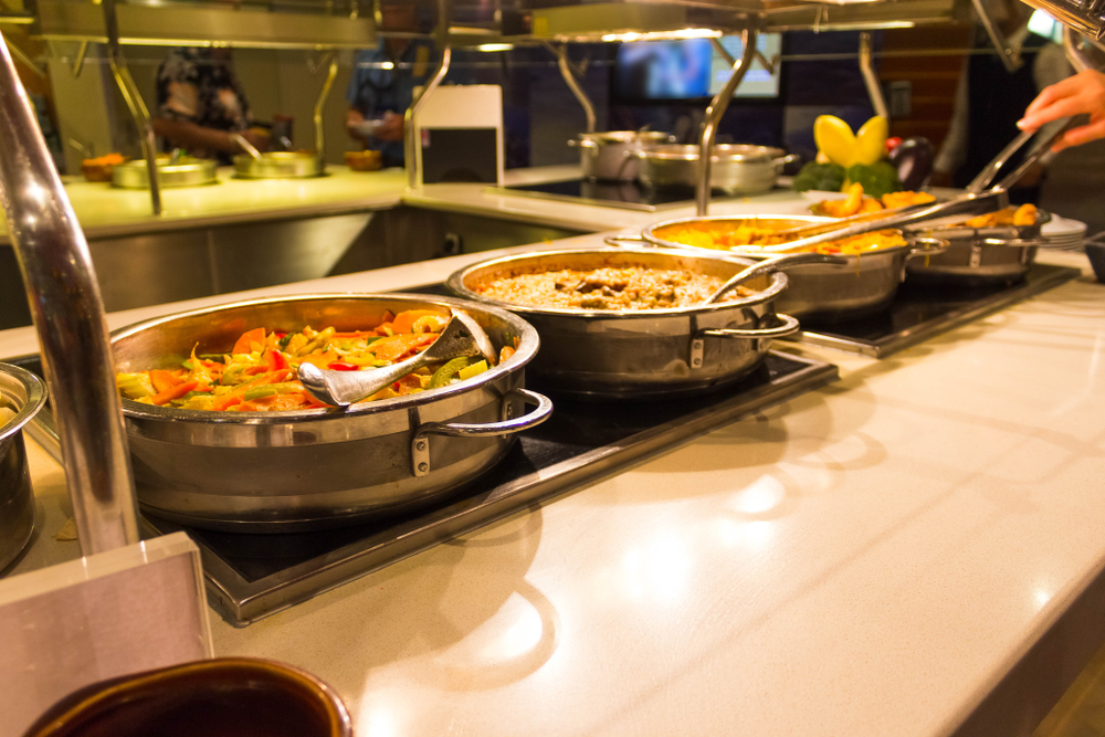 Dining Room Buffet aboard the abstract luxury cruise ship. Selective focus. vegetable dishes