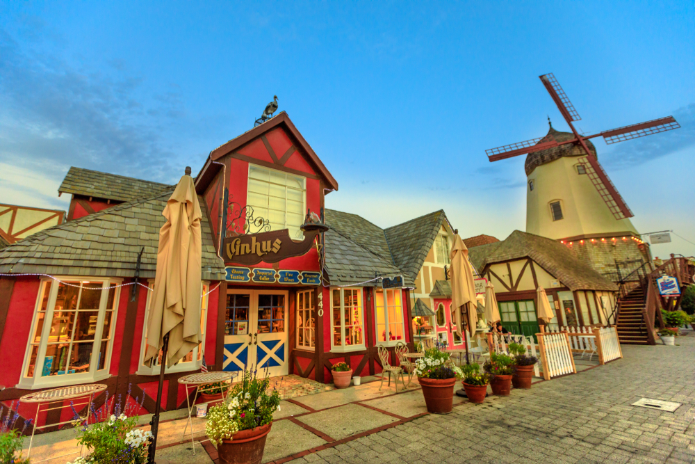 Solvang, California, United States - August 10, 2018: Solvang Danish Village typical architecture with old Windmill in Santa Ynez Valley, Santa Barbara County. Famous place. Blue hour shot.