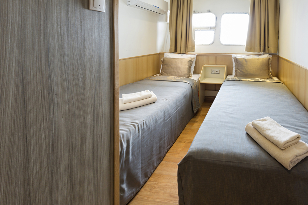 Interior of a cabin bedroom on cruise boat hotel

