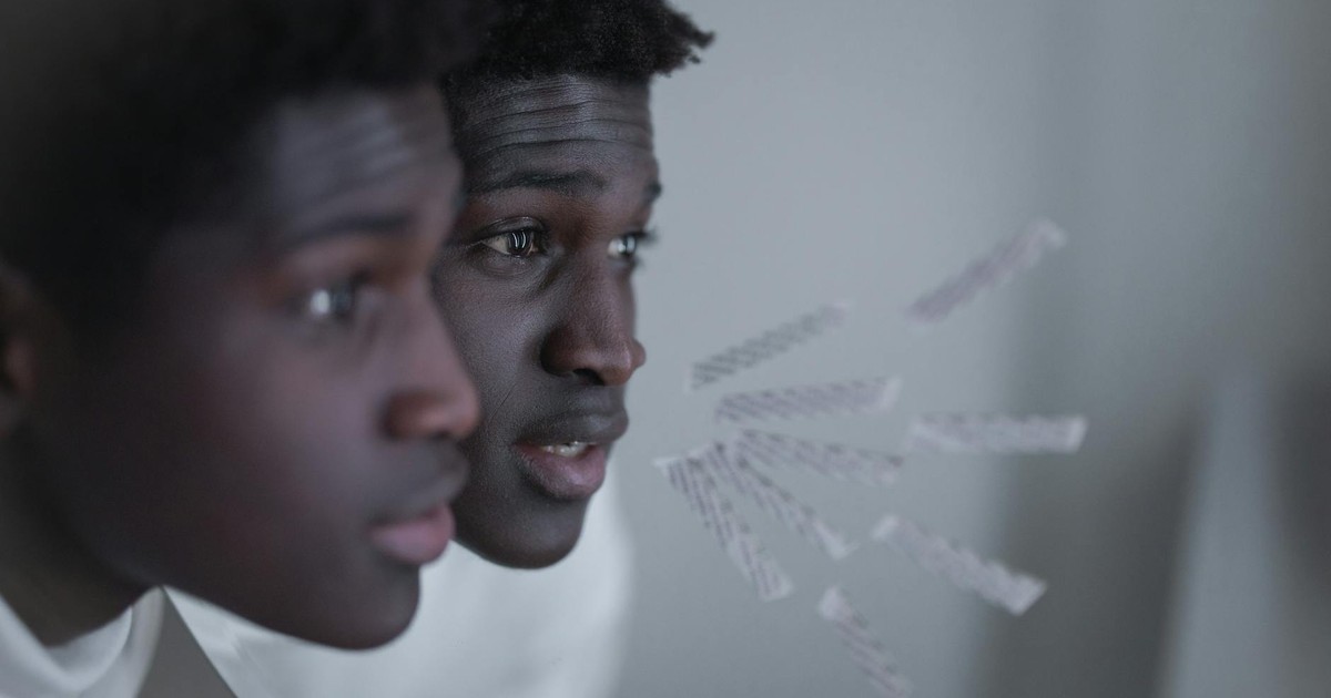 Captivating close-up of a man looking at his reflection, evoking introspection and self-awareness.