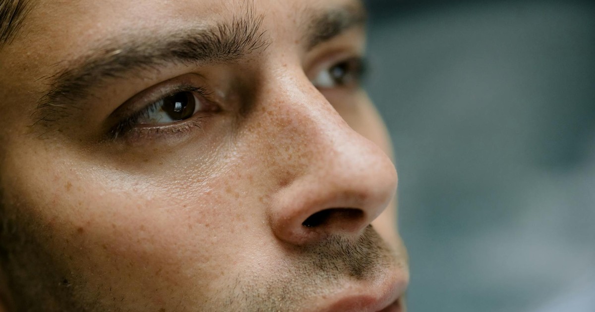 Detailed close-up portrait focusing on a man's facial features and skin texture.