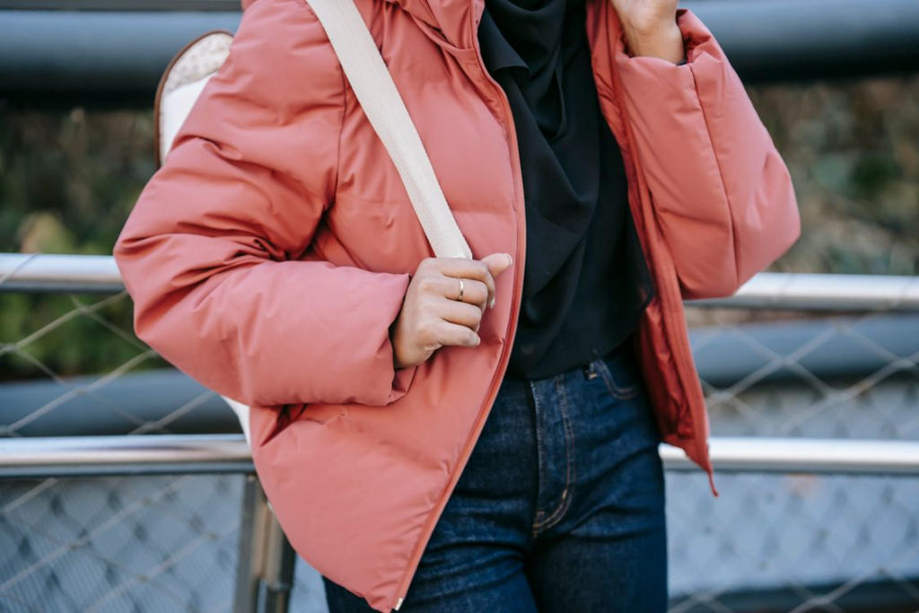 woman in pink puffer jacket