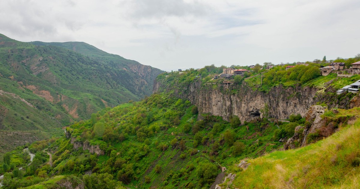 Lush green cliffs and distant hills in Dilijan National Park, Armenia, offering a breathtaking landscape view.