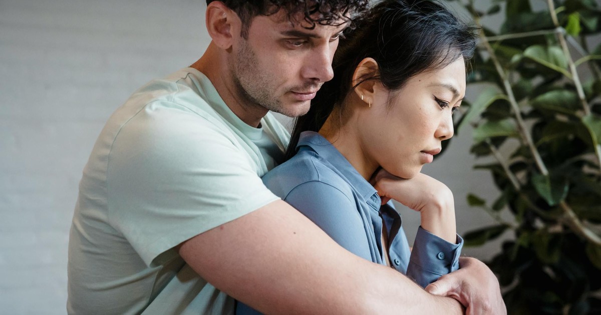 A close-up of a loving couple embracing, symbolizing intimacy and connection.