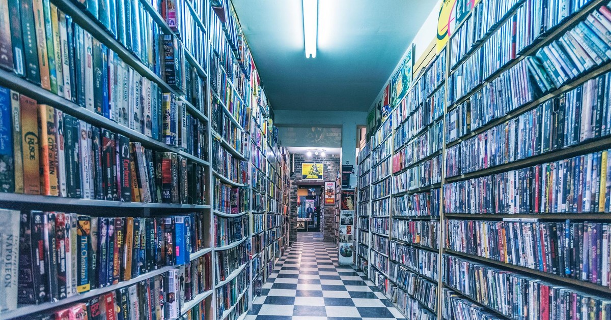 Explore a nostalgic video store aisle filled with classic VHS tapes, capturing retro vibes.