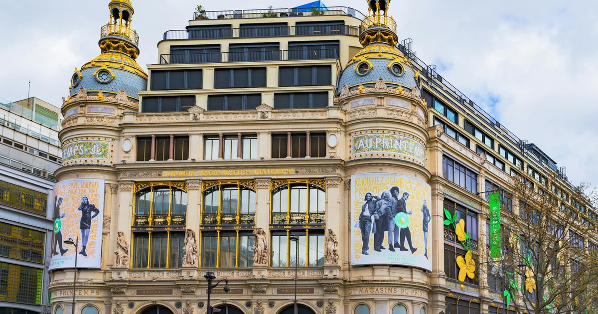 A vibrant view of the iconic Printemps department store in Paris showcasing its ornate architecture.