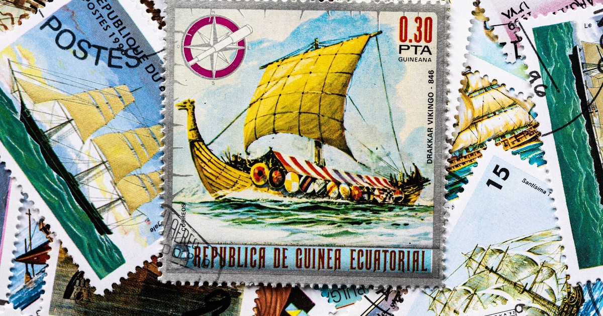 A vibrant assortment of vintage postage stamps featuring ships and nautical themes.