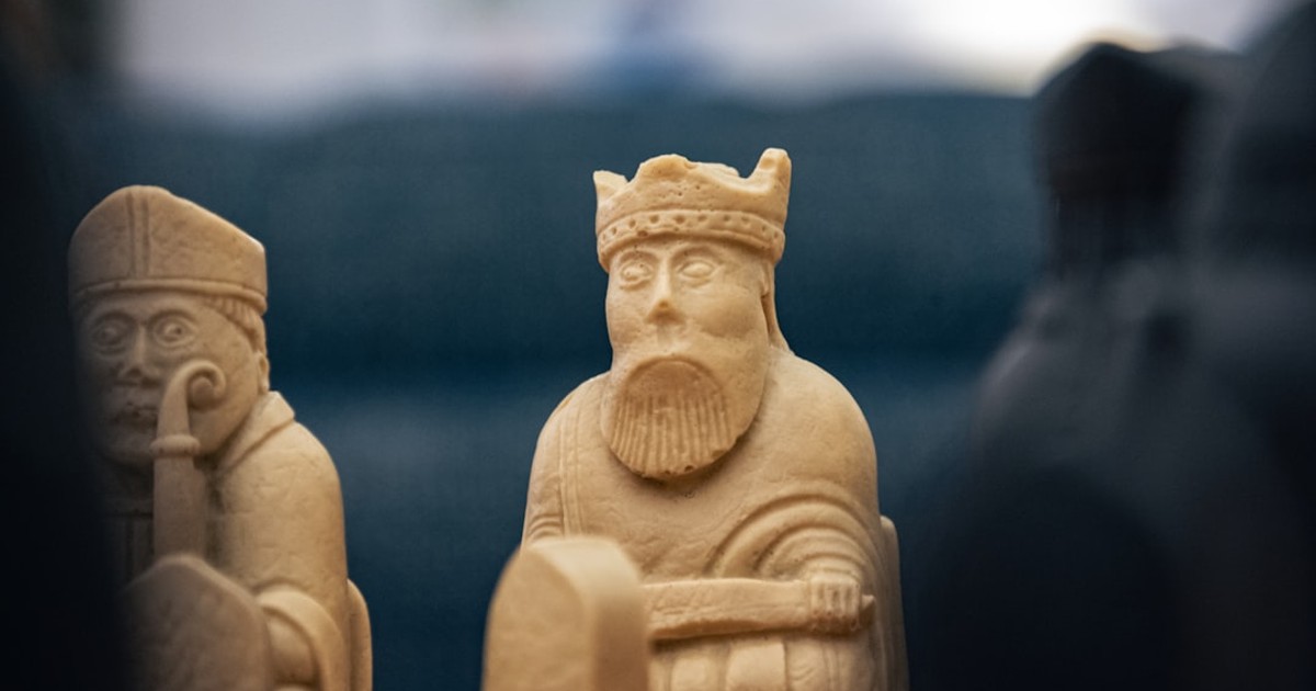 a close up of a statue of a king and a queen