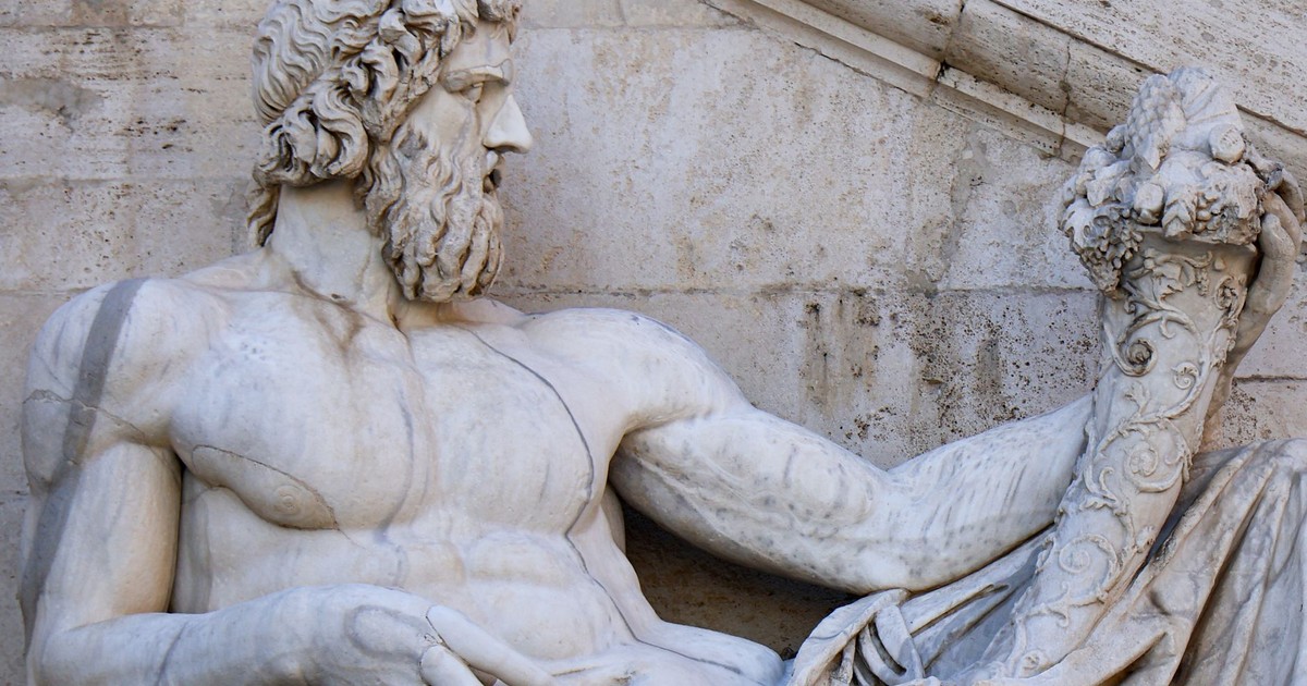 Close-up of Tiberinus, Roman god statue at Campidoglio, Rome, highlighting intricate details.