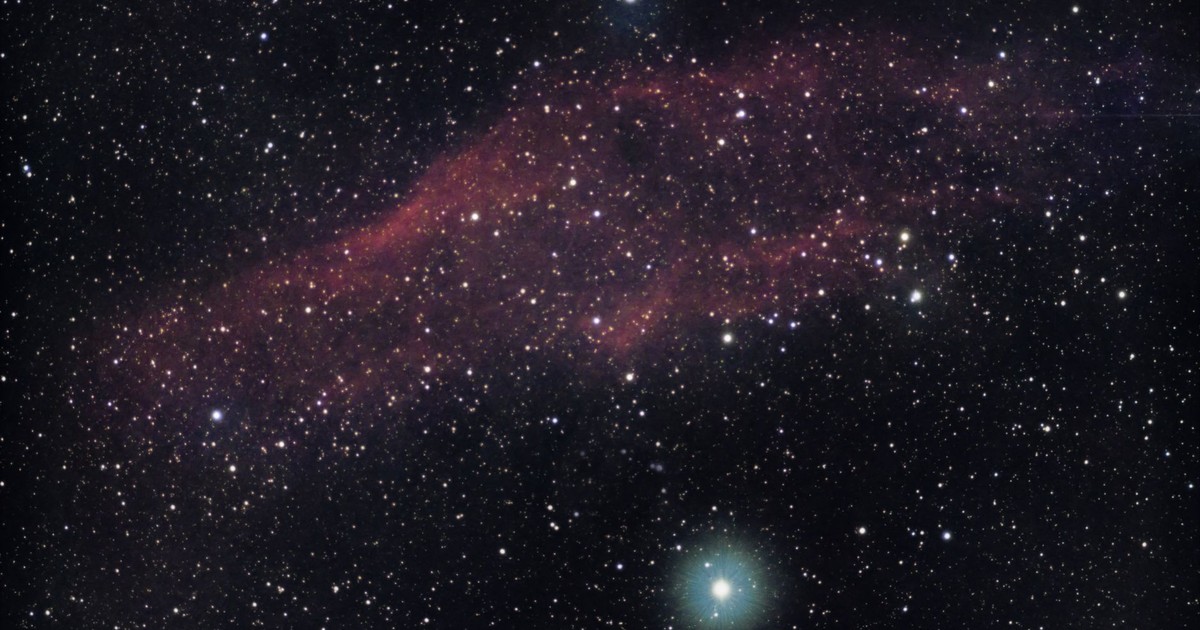 Explore the vibrant colors and stars of a cosmic nebula in deep space.