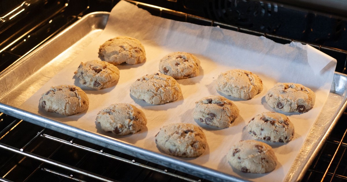 Delicious homemade chocolate chip cookies baking in an oven, fresh and ready to serve.