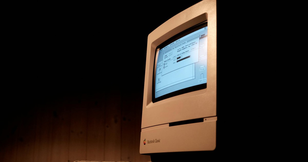 Close-up of a Macintosh Classic computer, showcasing vintage technology and nostalgia.