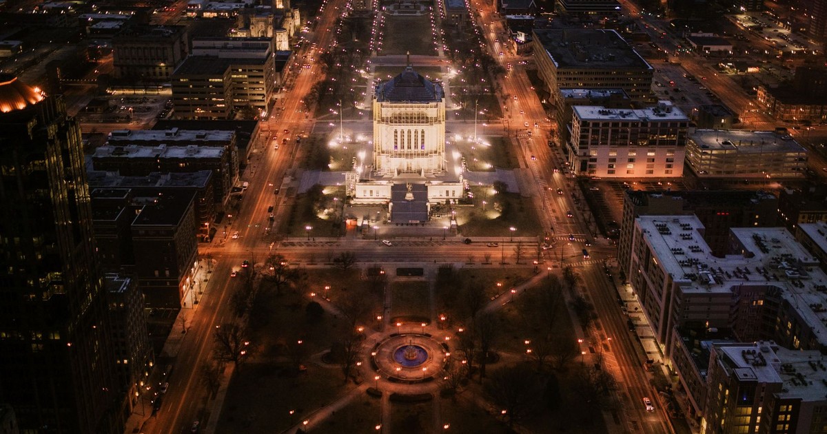 Breathtaking aerial night view of downtown Indianapolis featuring city lights and urban architecture.