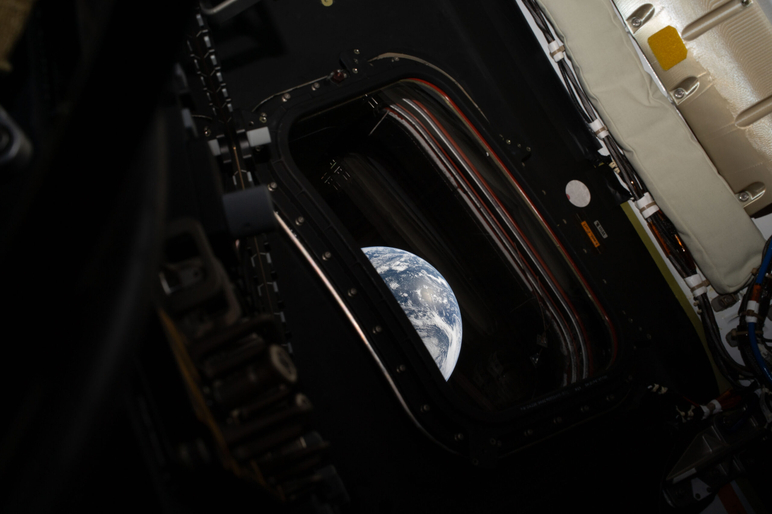 art002e000191 (April 3, 2026) - A view of Earth taken by NASA astronaut and Artemis II commander Reid Wiseman from one of the Orion spacecraft's four main windows after completing the translunar injection burn on April 2, 2026. Photo: Reid Wiseman / NASA
