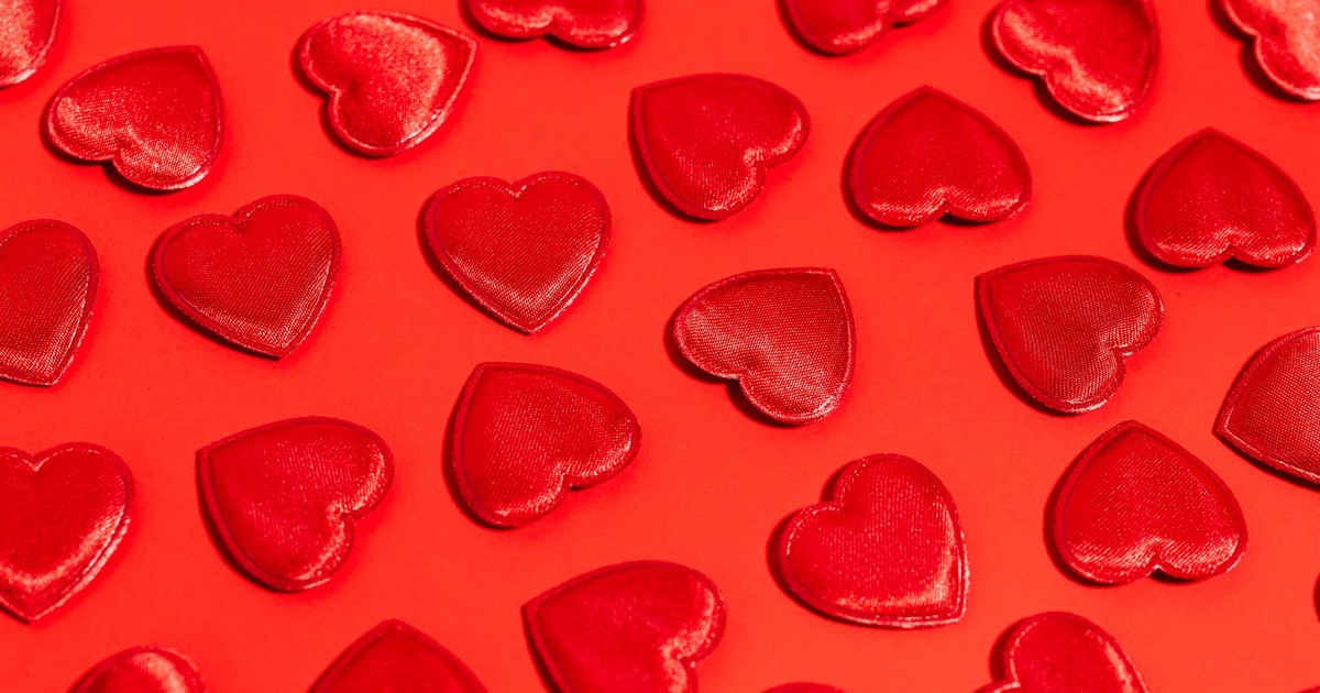 Festive red hearts on a bold red background perfect for Valentine's Day themes.