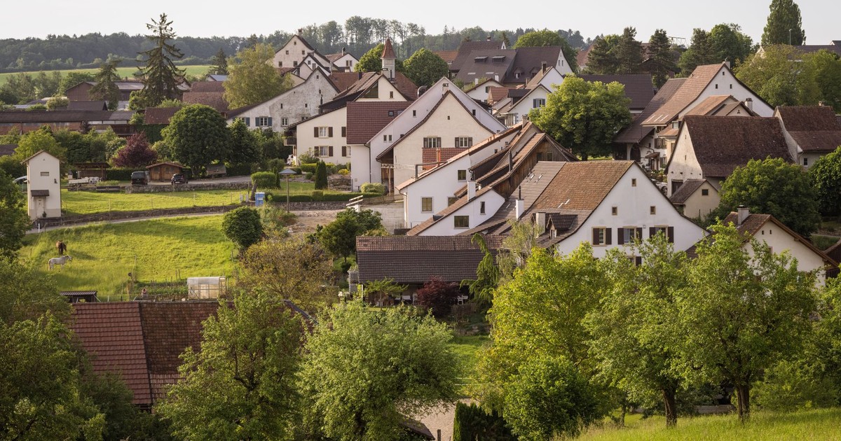 Scenic view of a picturesque village surrounded by greenery in spring.