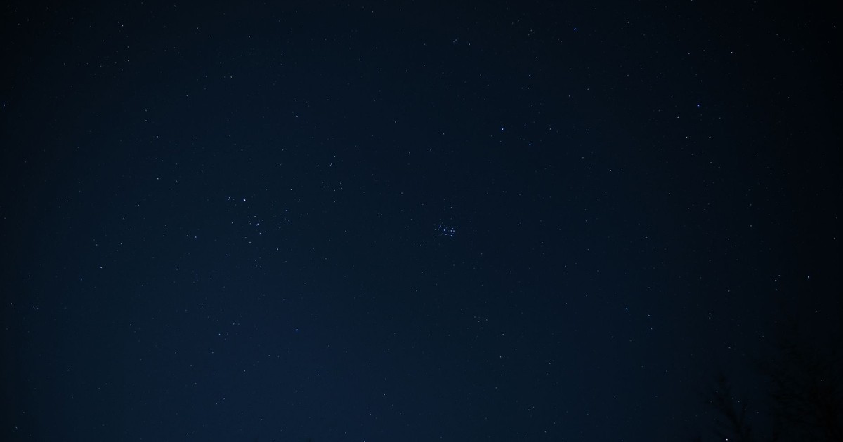 A serene view of a night sky filled with stars and constellations.