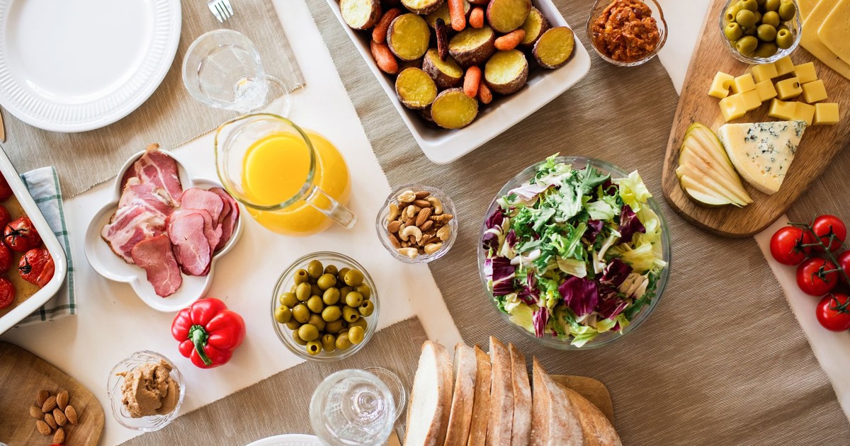 A vibrant table setting with a variety of fresh and delicious foods perfect for a festive gathering.