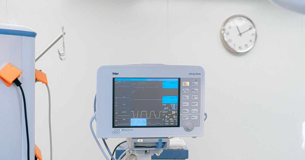 A modern heart rate monitor in a sterile hospital setting, showcasing medical technology.