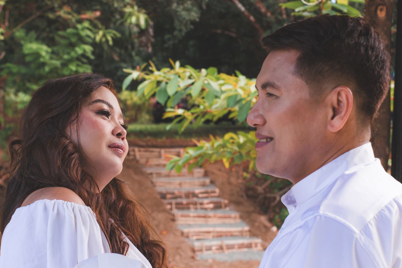 couple smiling outside