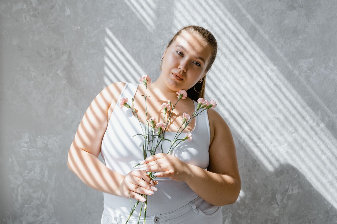 plus-sized woman with flowers