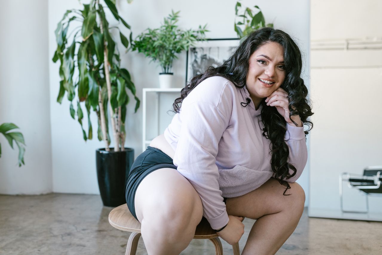 woman sitting on stool in house