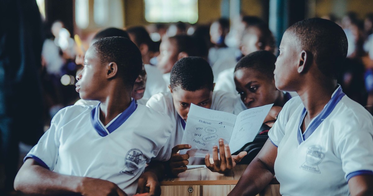 African students in a classroom collaborate on a learning assignment.