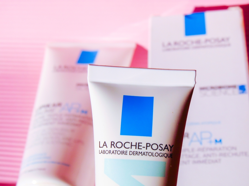 Bogor, Indonesia - May 13, 2025: A view of the acne-prone skin cream La Roche-Posay Effaclar Duo+M moisturizer on the pink background.