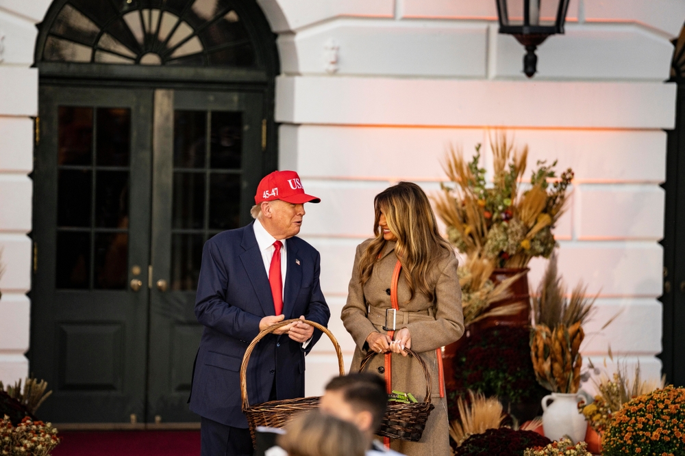 U.S. President Donald Trump and first lady Melania Trump handout candy to children during the annual Halloween at the White House event on the South Lawn of the White House on October 30, 2025