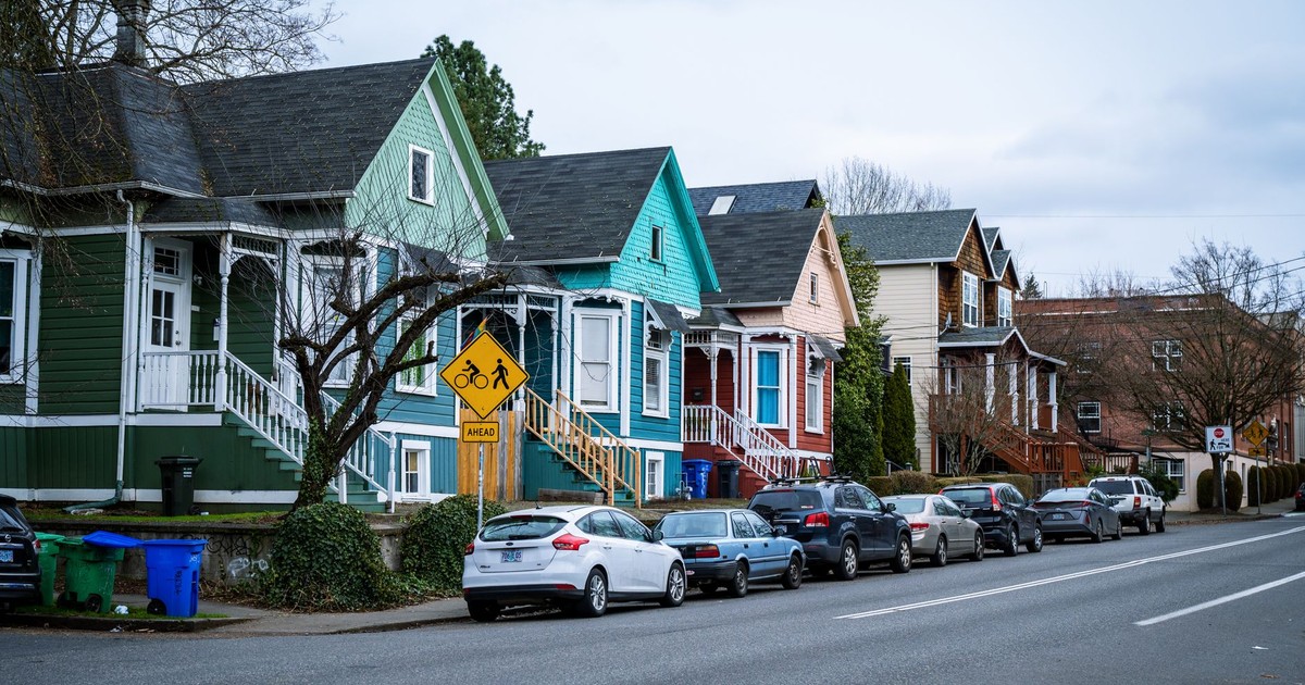 Picturesque street view of colorful, charming houses in a Portland, OR suburb, showcasing urban living.