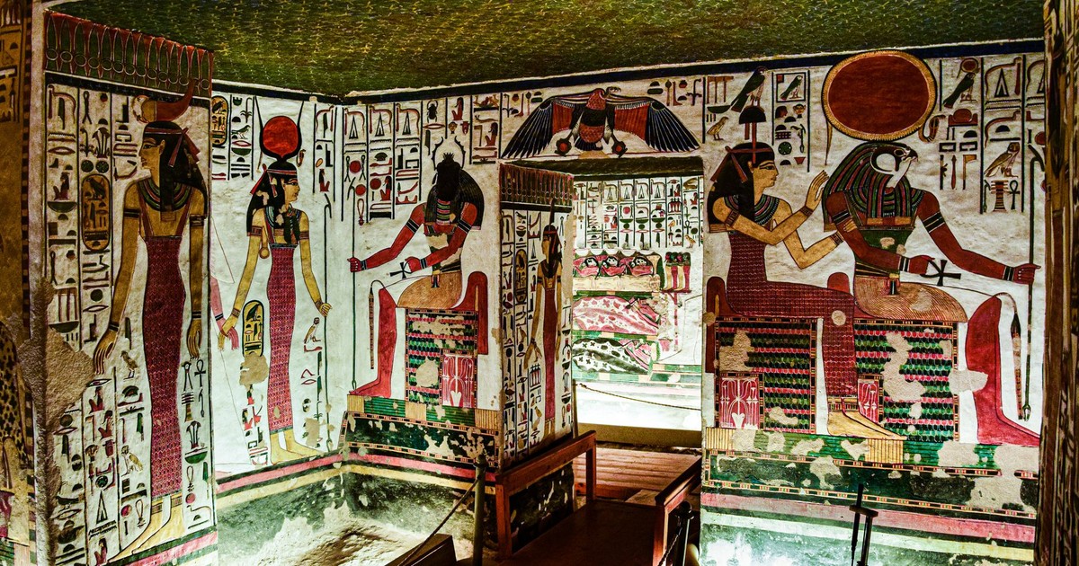 Colorful Egyptian murals depicting gods found inside an ancient tomb, rich in history.
